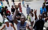 People celebrate in a street in Bujumbura May 13, 2015. REUTERS/Goran Tomasevic